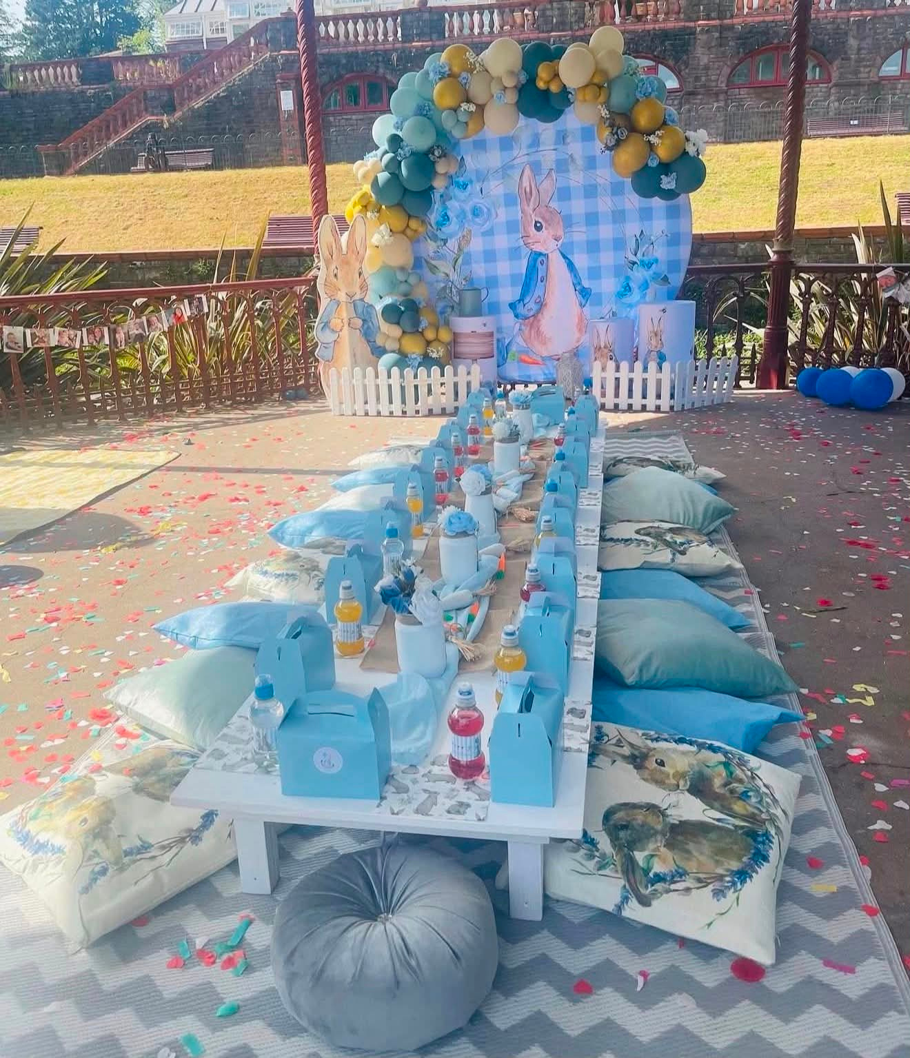 Blue personalised children’s picnic table party setup